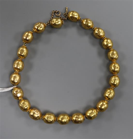 A continental yellow metal bead necklace, approx. 37cm.